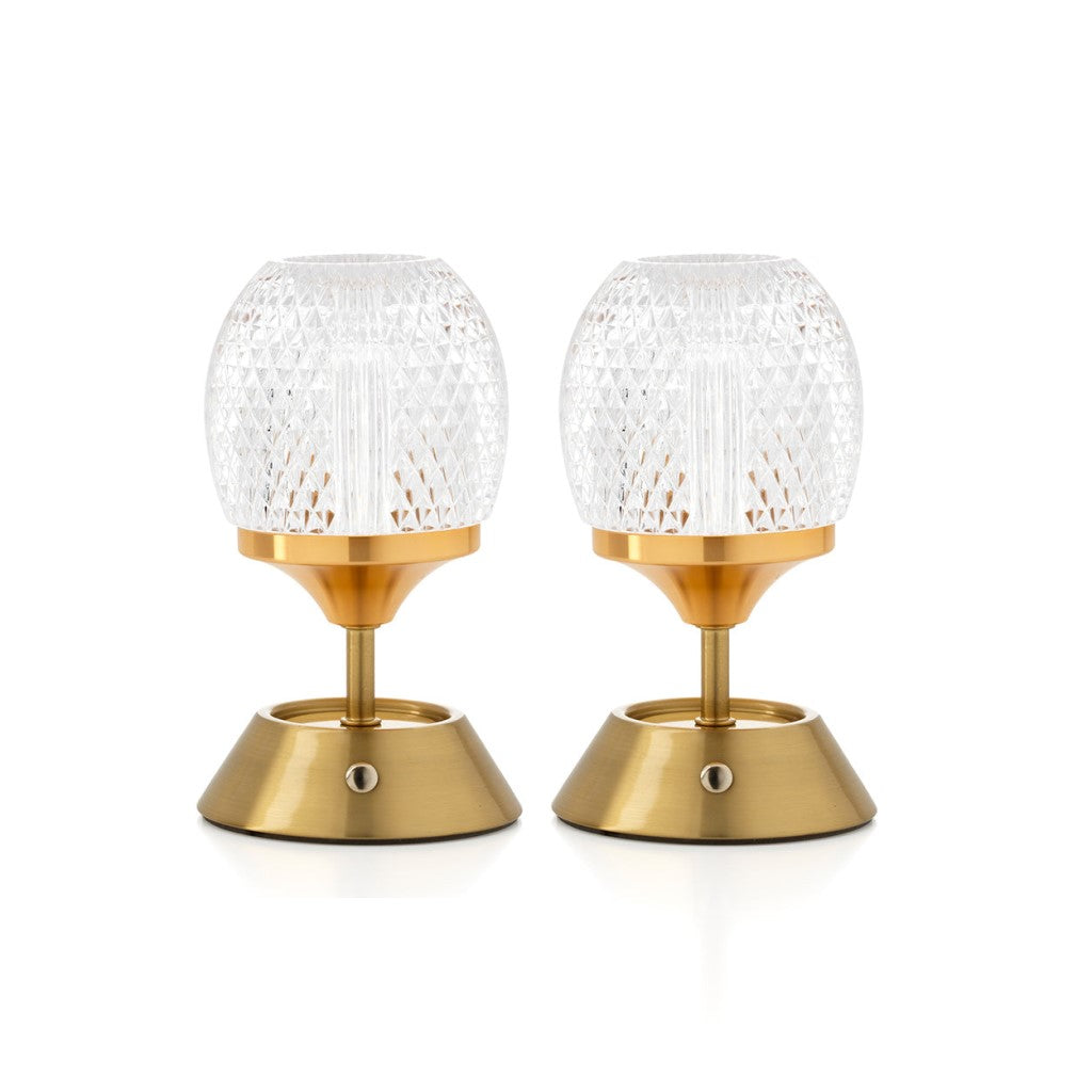 Hero-afbeelding van een set van twee oplaadbare The Glow Sinatra LED-tafellampen van Bazar Bizar. De set toont twee identieke lampen met goudkleurige bases en gedetailleerde kapjes van gefacetteerd kristalglas, naast elkaar tegen een witte achtergrond.