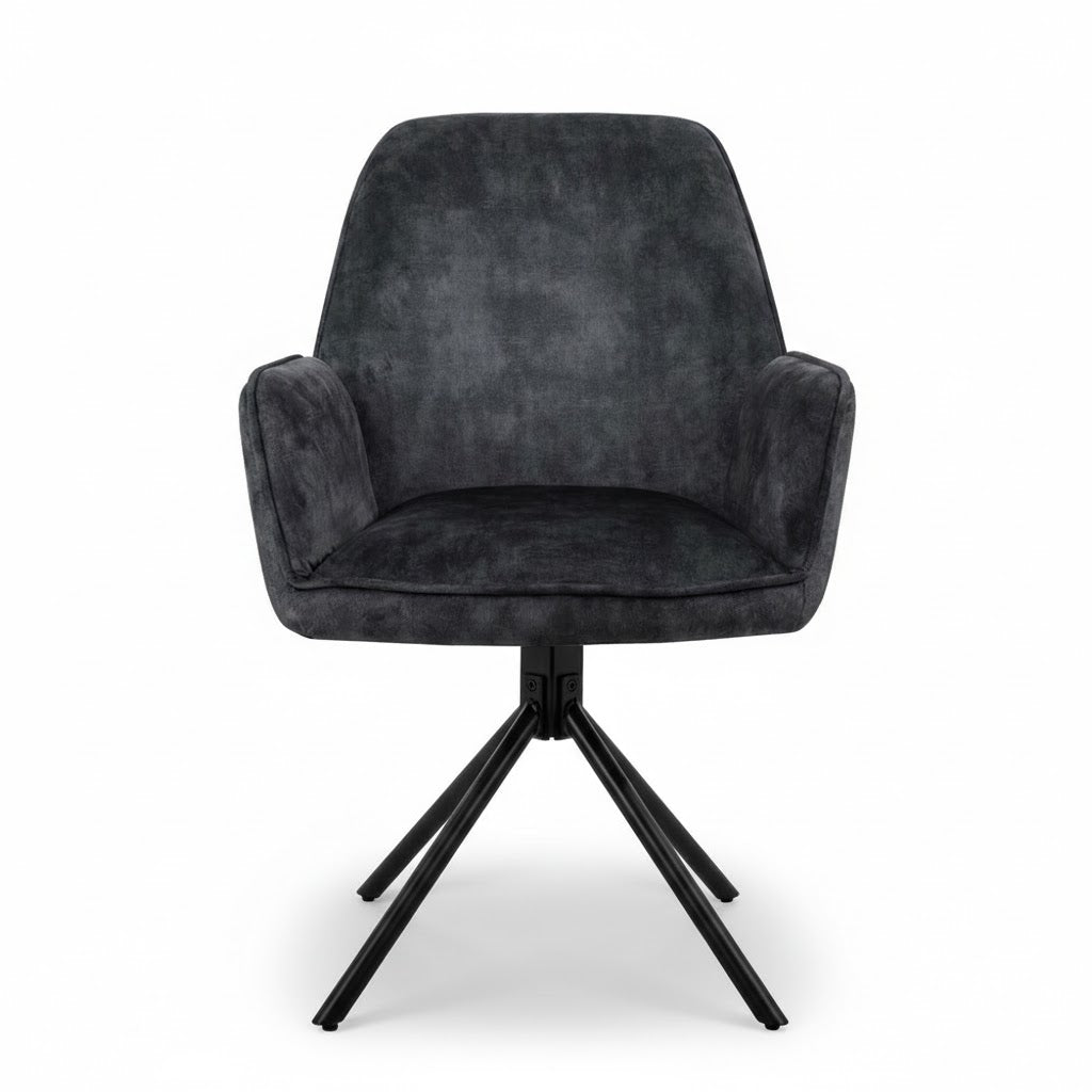 Luxe industriële eetkamerstoel Noah in antraciet velvet met zwart metalen poten, staand op een witte achtergrond met natuurlijke schaduwval.